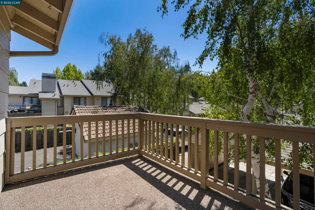 a view of a two chairs in the balcony