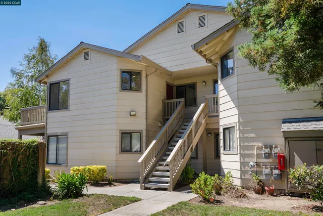 a front view of a house with stairs