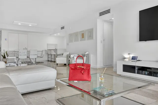 a living room with furniture and a table