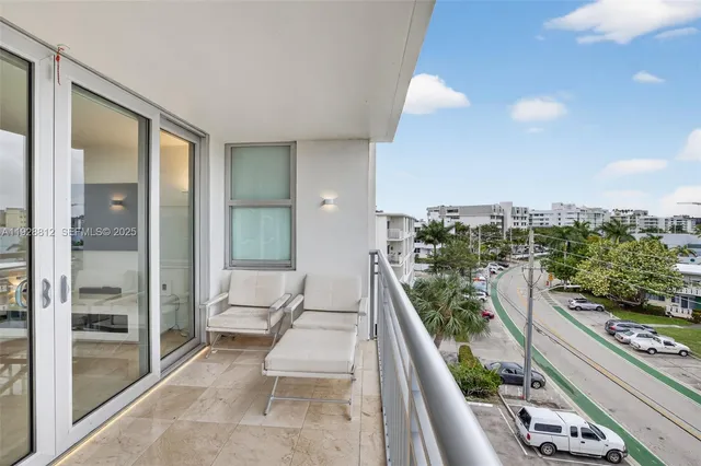 a bathroom with a sink mirror toilet and shower