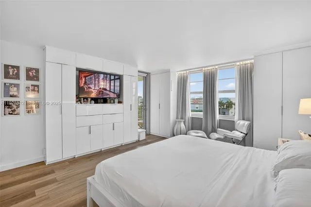 a view of swimming pool with seating area and barbeque oven