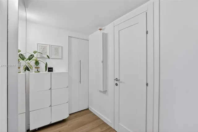 an aerial view of a house with a lake view