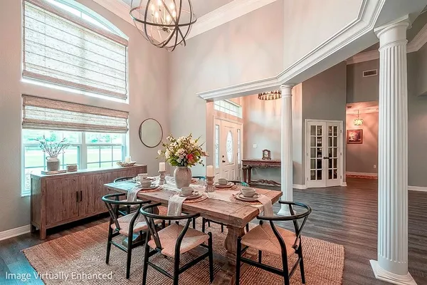 a view of a dining room with furniture window and outside view