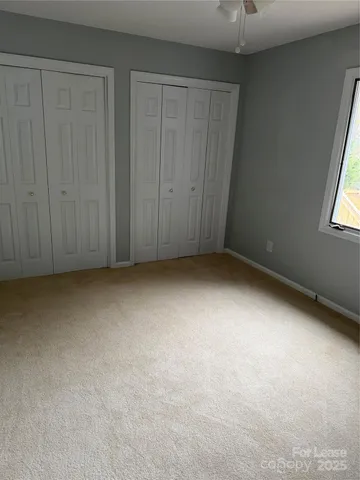 an empty room with a empty space and a window