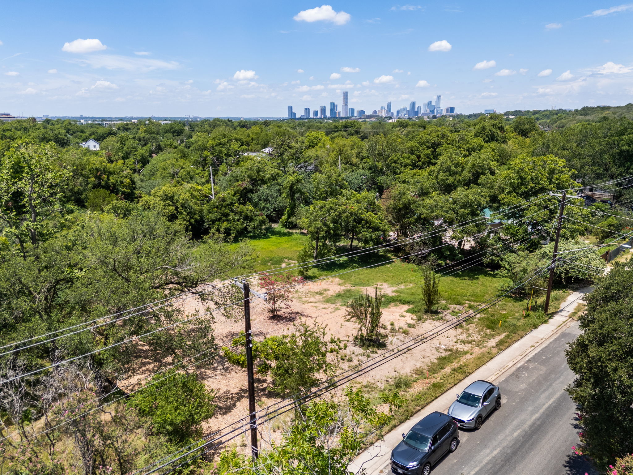 4801 Ledesma Road Austin, TX 78721 - Photo 9 of 24 An aerial perspective reveals a verdant landscape with city views, offering a prime building opportunity.