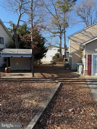 a view of yard with patio