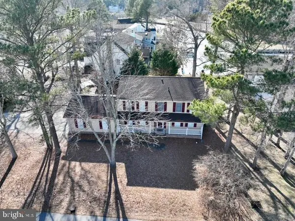 a large kitchen with a table and chairs in it
