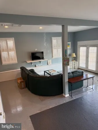 a view of a room with kitchen view and living room