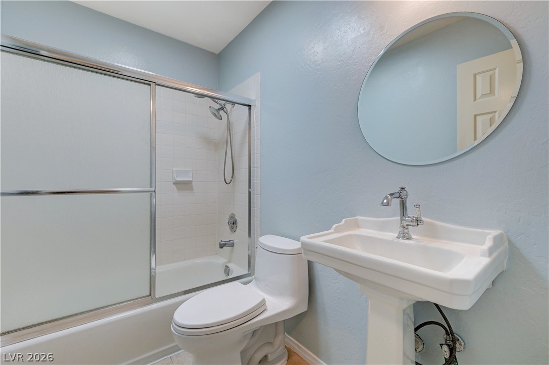 7631 Bermuda Road Las Vegas, NV 89123 - Photo 26 of 64 A well-appointed bathroom offers a classic pedestal sink and convenient tub/shower combination.