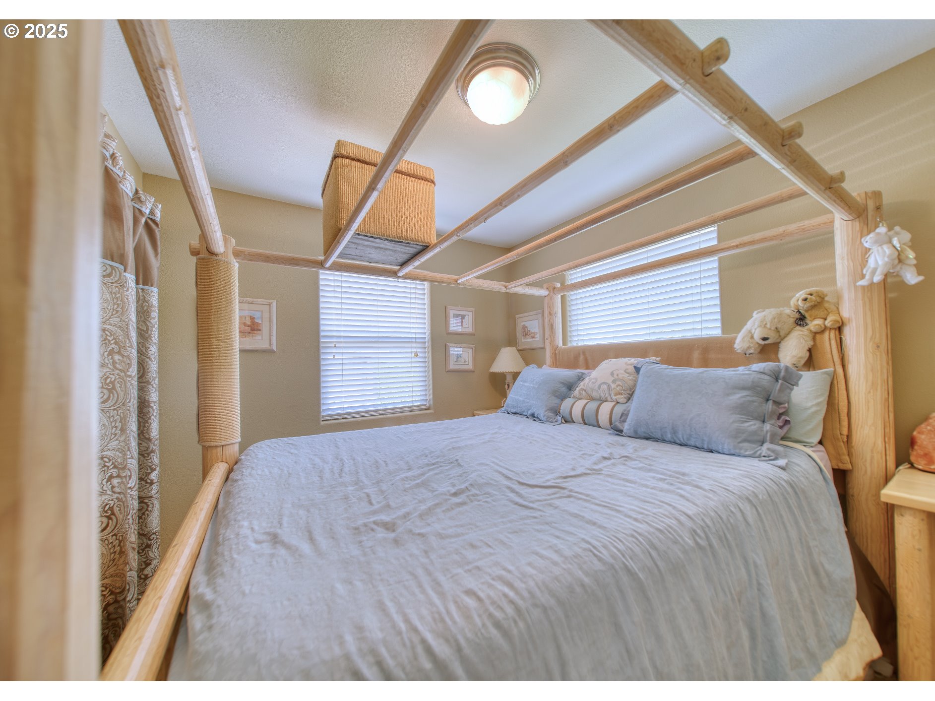 33812 Berg Road Warren, OR 97053 - Photo 5 of 20 a bedroom with a bed and a large mirror