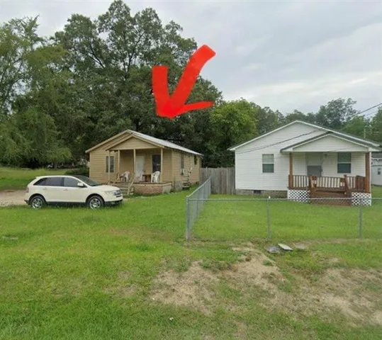a house view with a garden space