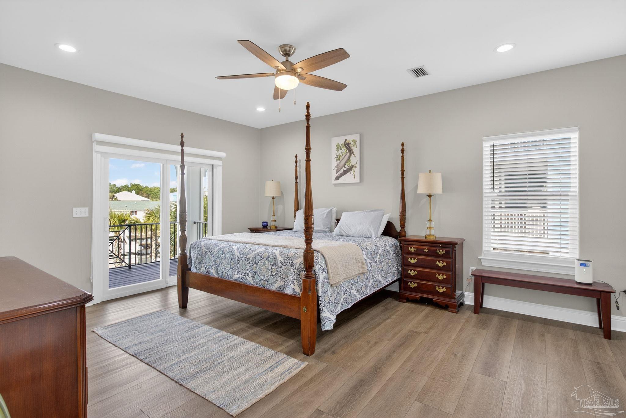 26355 Marina Road Orange Beach, AL 36561 - Photo 18 of 58 a bedroom with a bed and a window