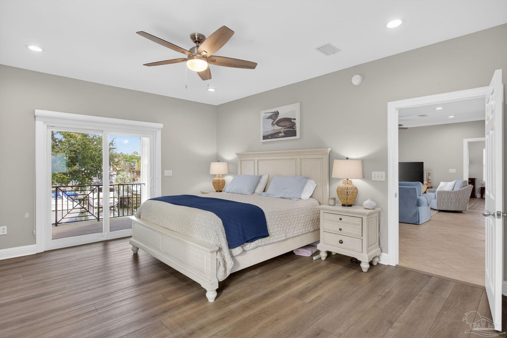26355 Marina Road Orange Beach, AL 36561 - Photo 23 of 58 a spacious bedroom with a large bed and a large window