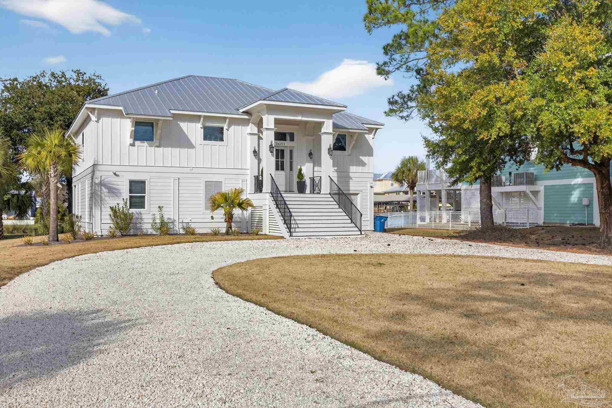 26355 Marina Road Orange Beach, AL 36561 - Photo 4 of 58 front view of a house with a patio