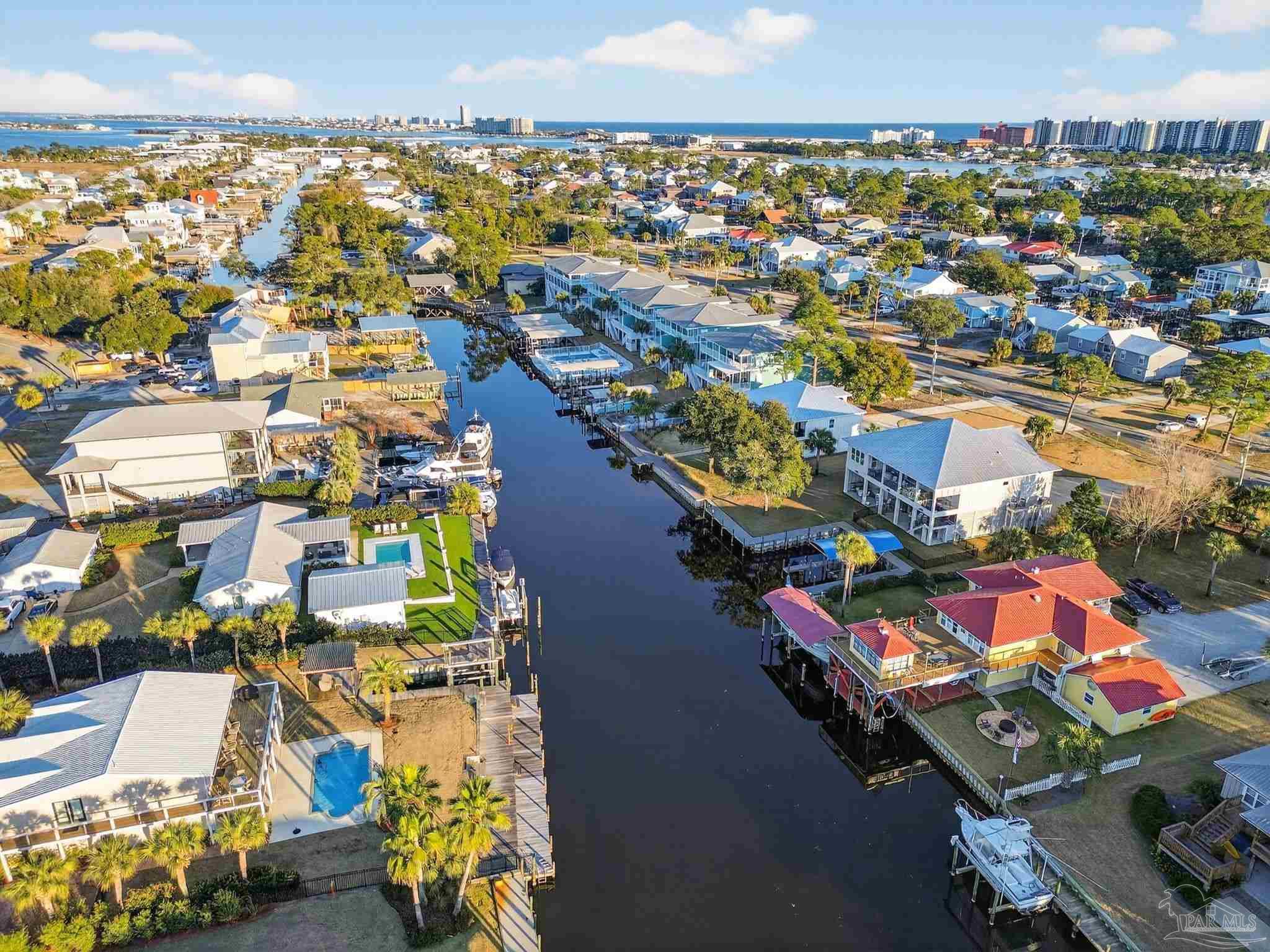 26355 Marina Road Orange Beach, AL 36561 - Photo 47 of 58 an aerial view of residential houses with outdoor space and swimming pool