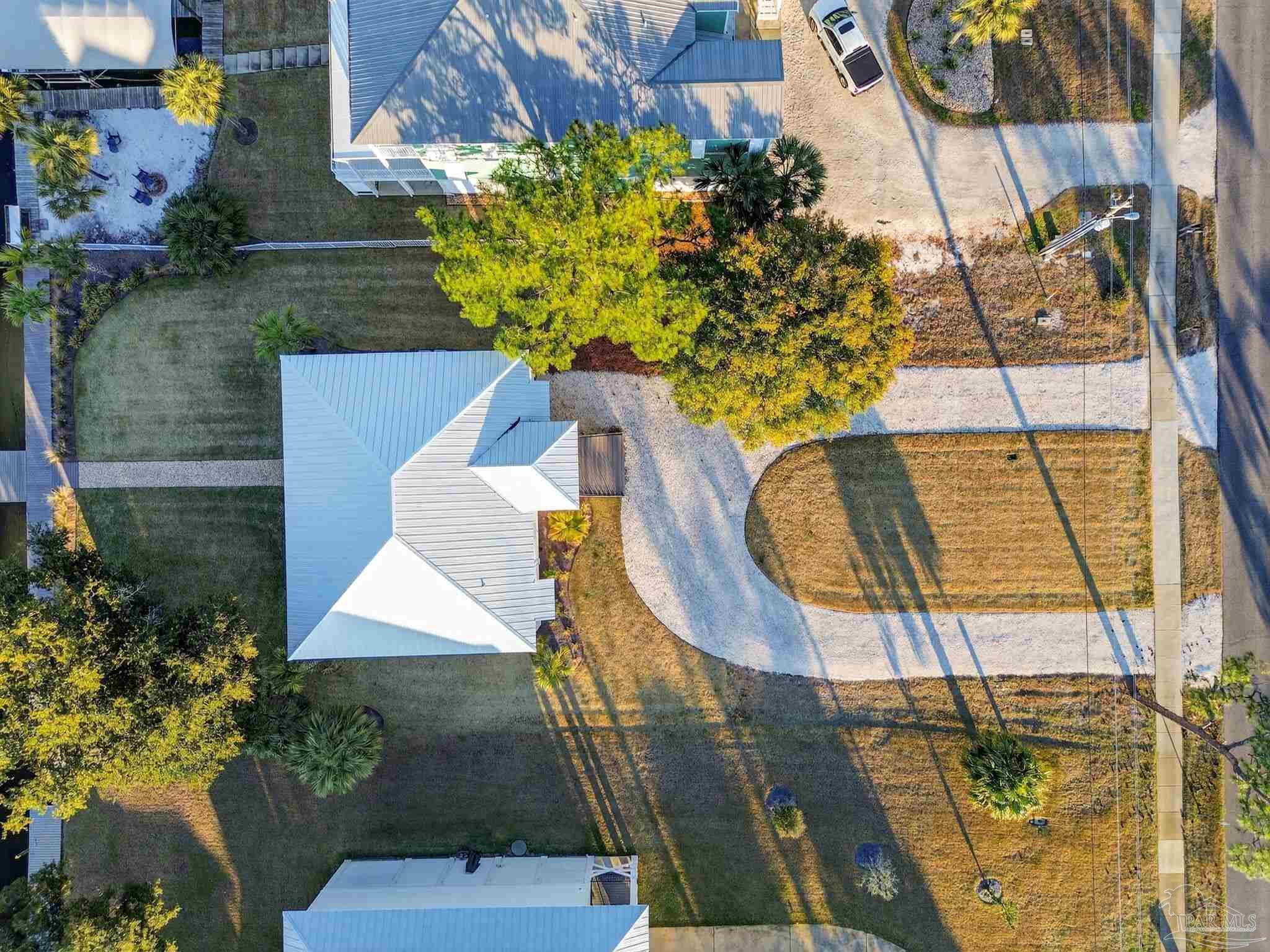 26355 Marina Road Orange Beach, AL 36561 - Photo 51 of 58 a picture of a flower plants with wooden fence