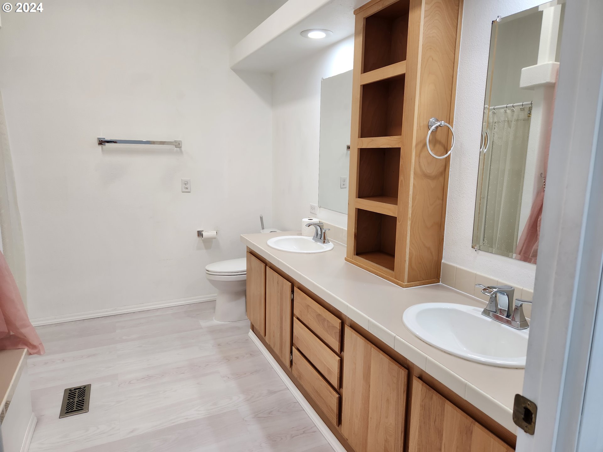 1675 Kristi Loop Lakeside, OR 97449 - Photo 16 of 30 a bathroom with a sink a toilet and shower