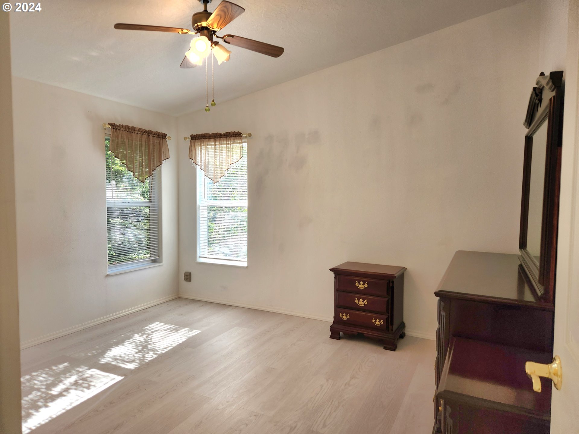 1675 Kristi Loop Lakeside, OR 97449 - Photo 19 of 30 a living room with furniture and a window