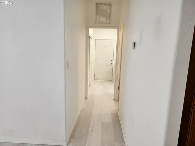 a bathroom with a sink a toilet and a shower