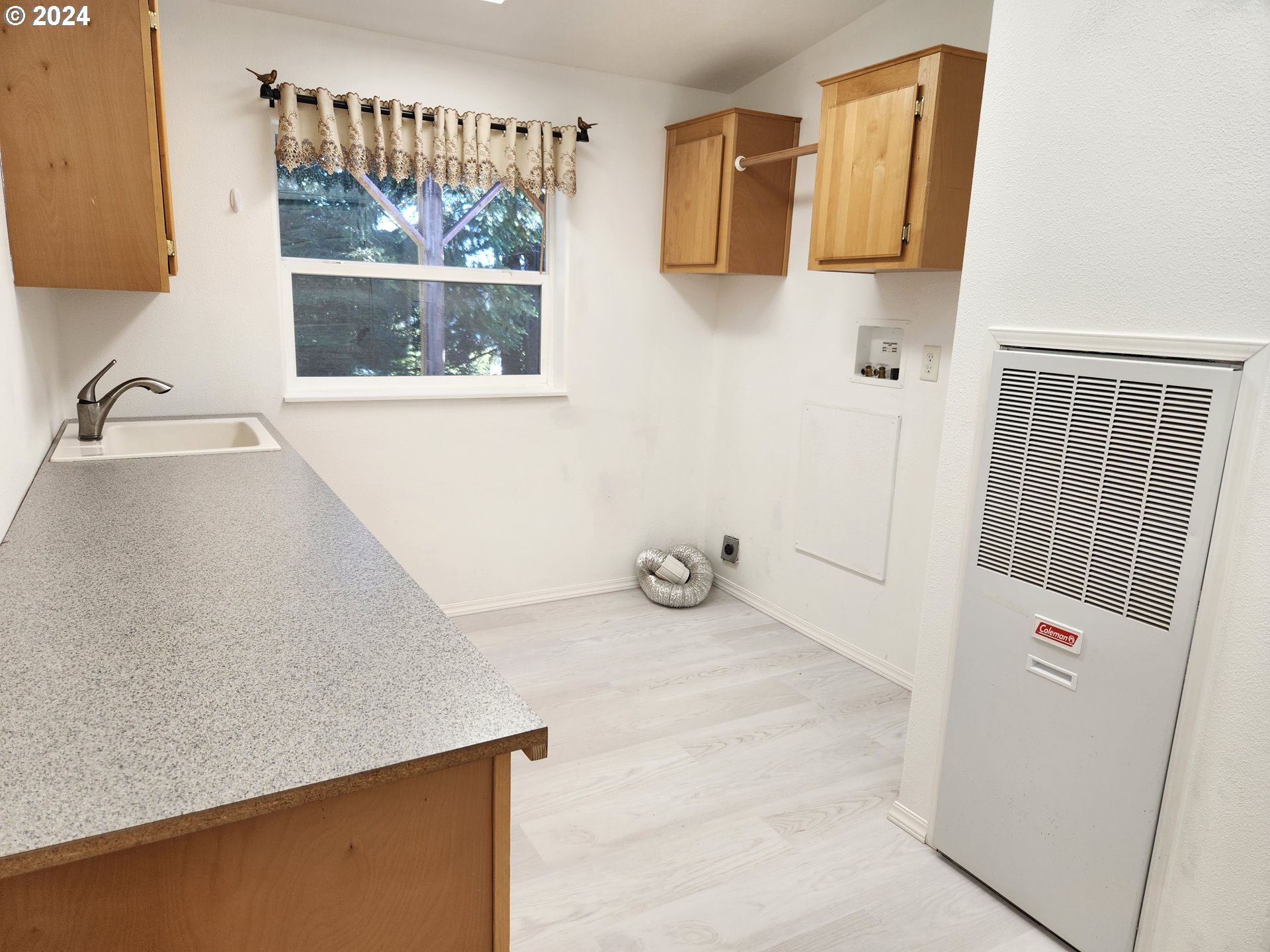 1675 Kristi Loop Lakeside, OR 97449 - Photo 25 of 30 a view of an empty room and window