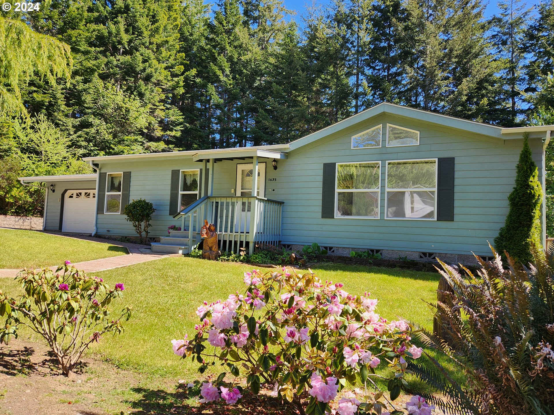 1675 Kristi Loop Lakeside, OR 97449 - Photo 3 of 30 a front view of house with yard