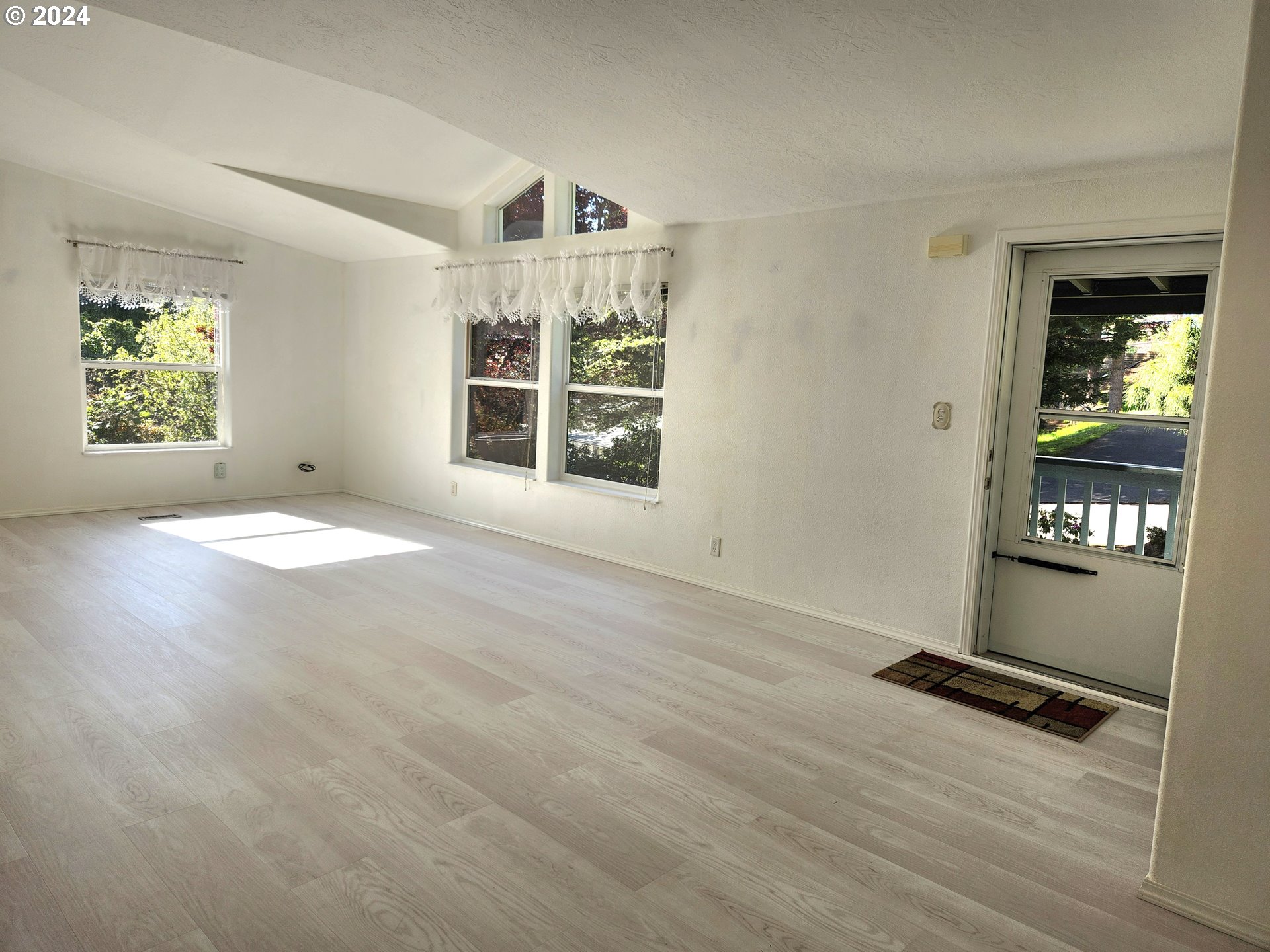 1675 Kristi Loop Lakeside, OR 97449 - Photo 7 of 30 an empty room with windows