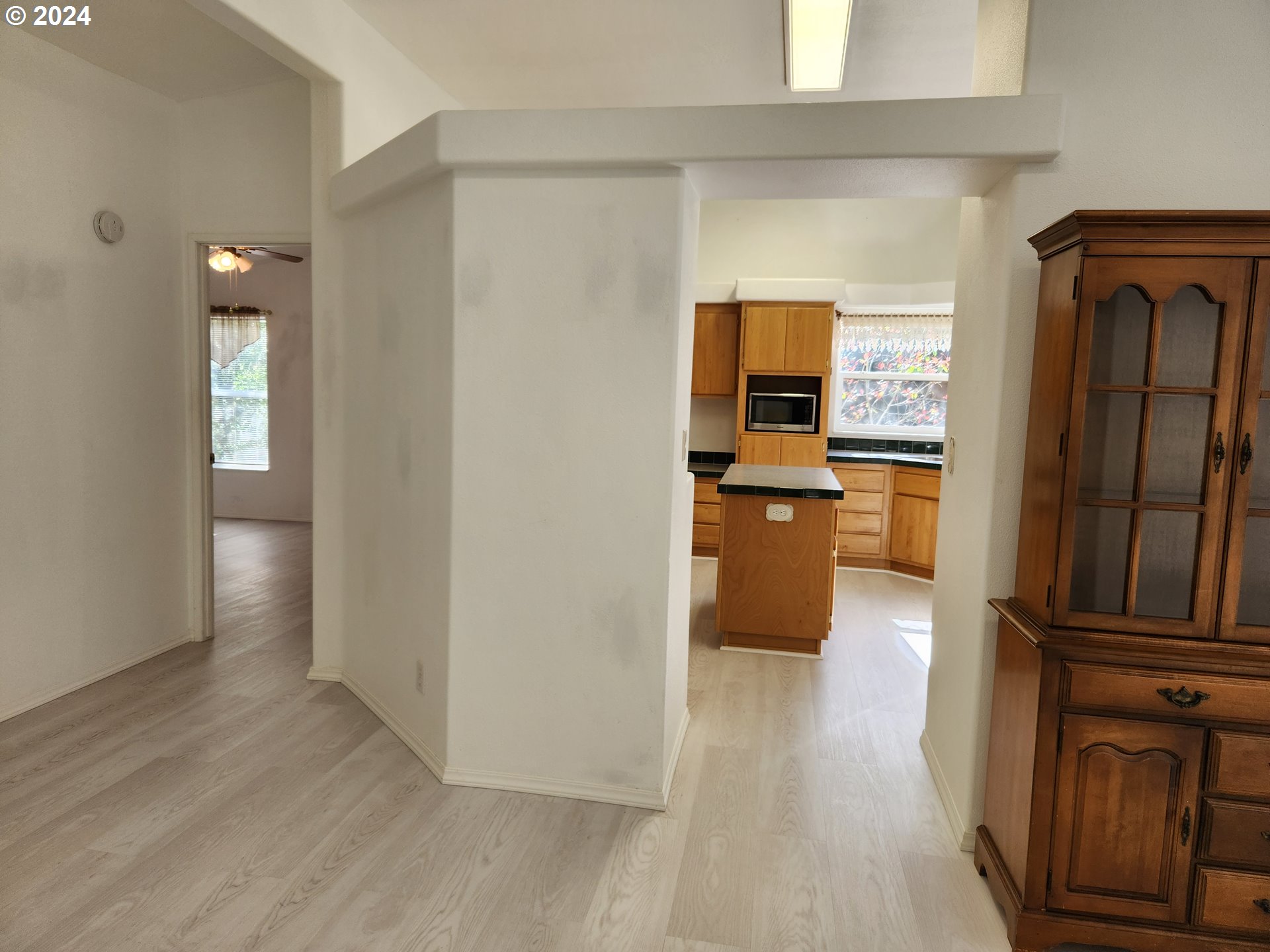 1675 Kristi Loop Lakeside, OR 97449 - Photo 9 of 30 a kitchen with granite countertop a refrigerator and a stove
