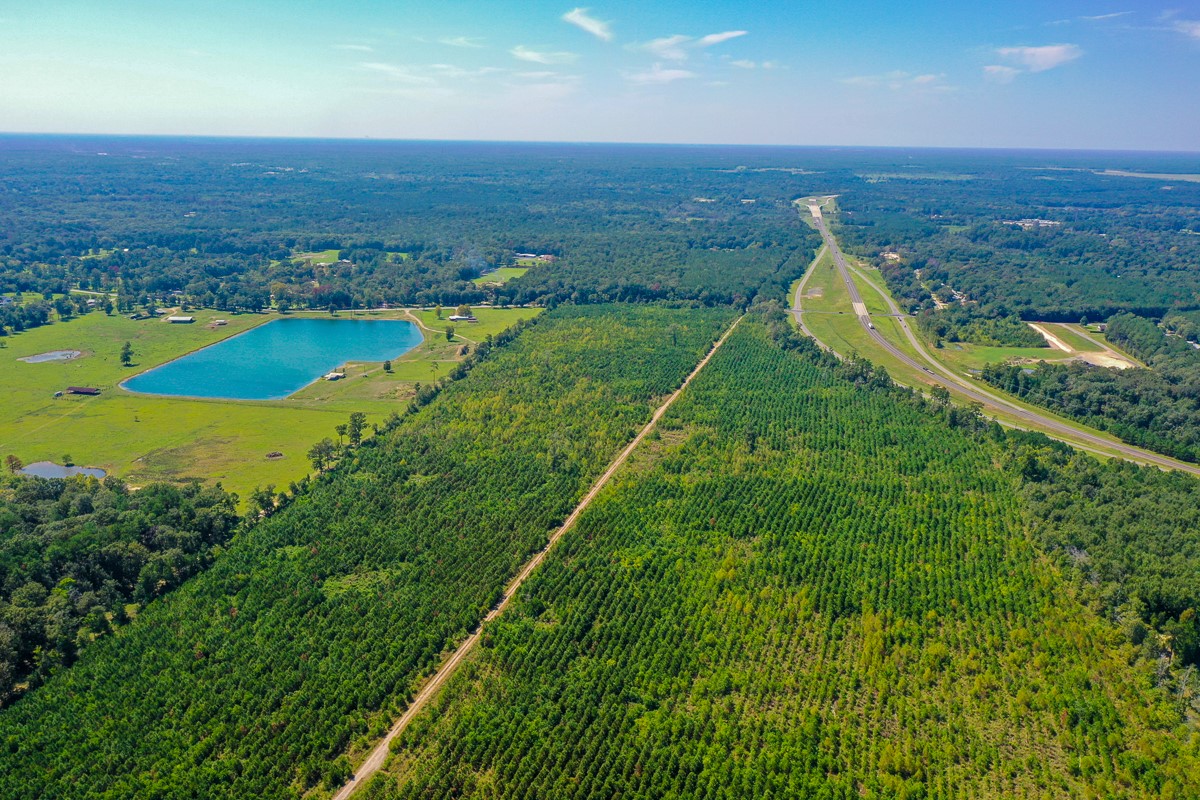 0 Fm 1010 Cleveland, TX 77327 - Photo 29 of 35 an aerial view of residential houses with outdoor space and trees