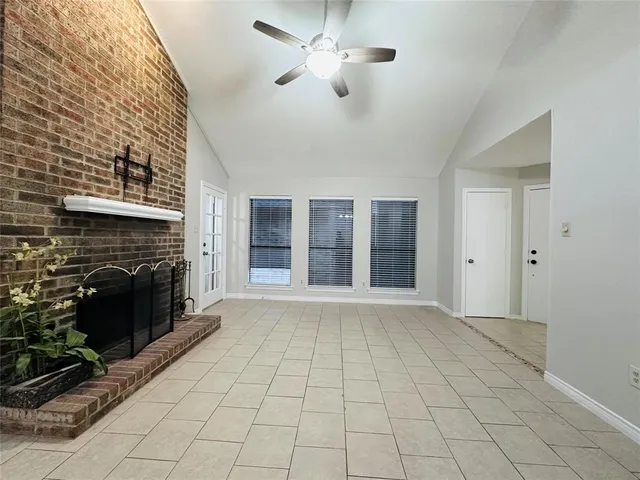 a view of an empty room with a fireplace
