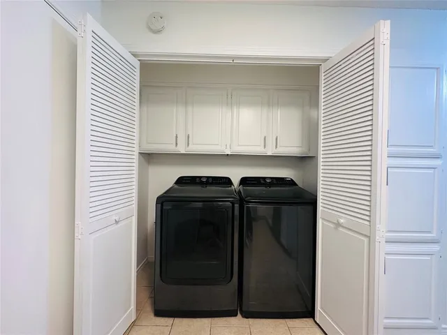 a view of a utility room with granite countertop