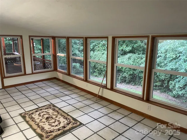 a view of workspace with wooden floor chairs