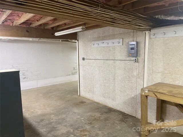 a view of a house with a yard balcony and furniture