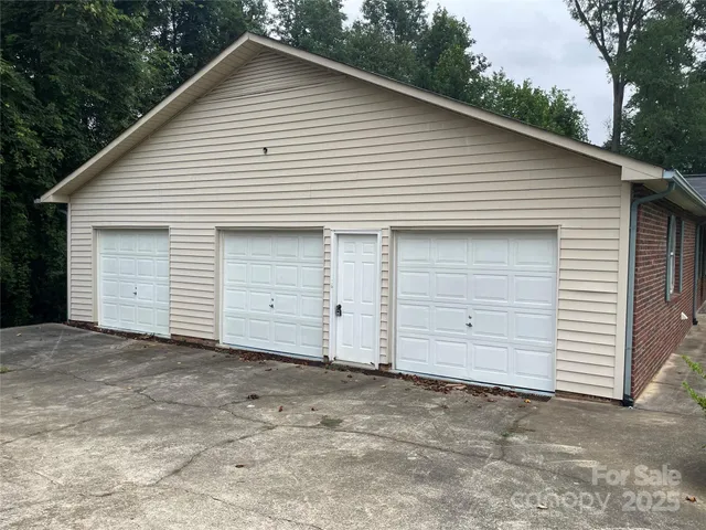 a view of a field with a tree in the background