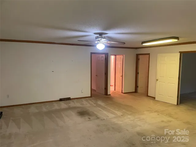 an empty room with fan