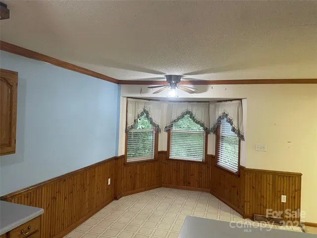 a bathroom with a tub and a shower