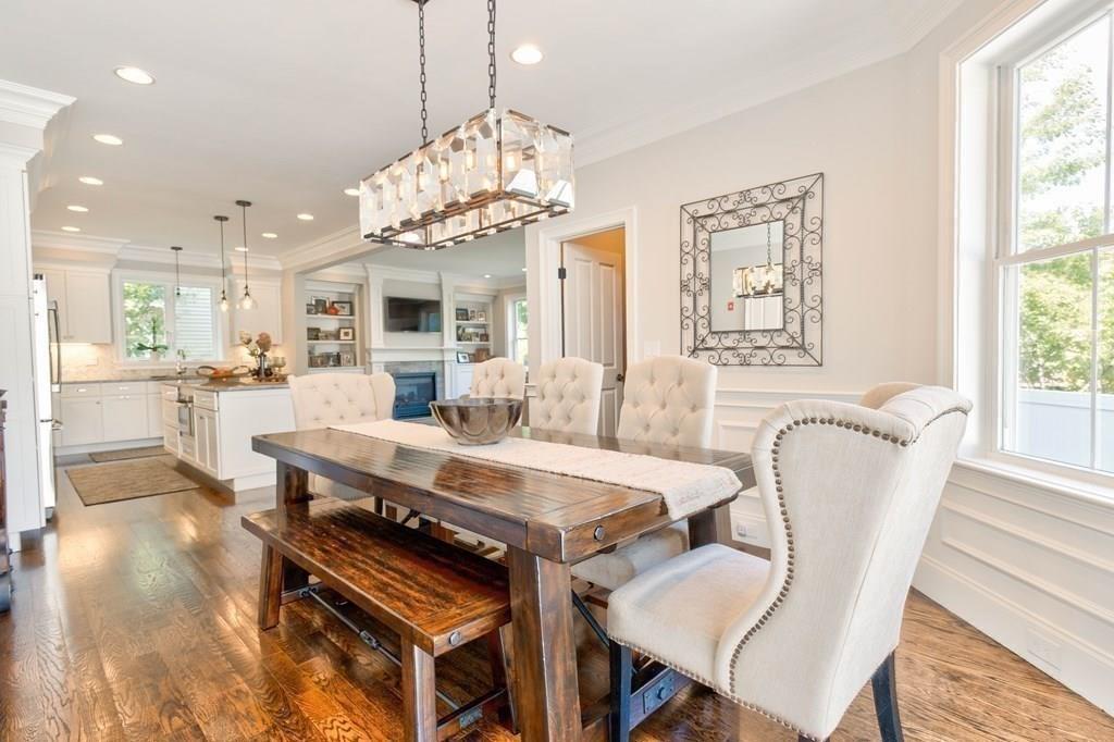 185 Cross Street Winchester, MA 01890 - Photo 11 of 41 a view of a dining room with furniture a chandelier and wooden floor