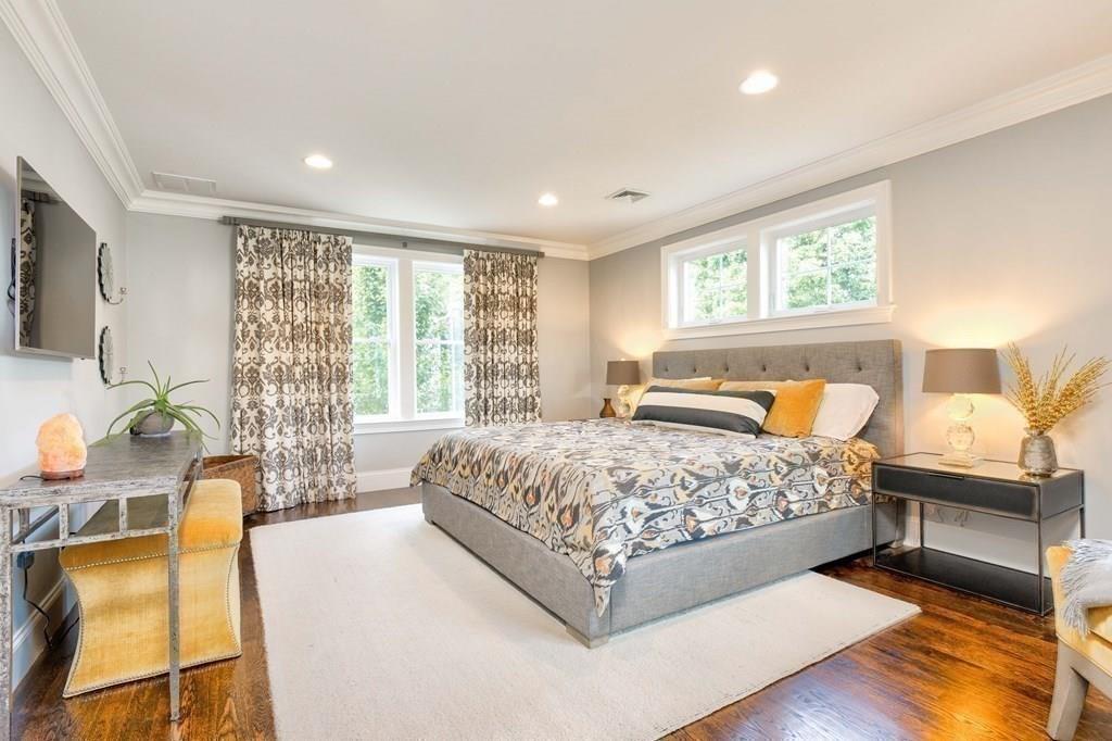 185 Cross Street Winchester, MA 01890 - Photo 14 of 41 a bedroom with a bed and wooden floor