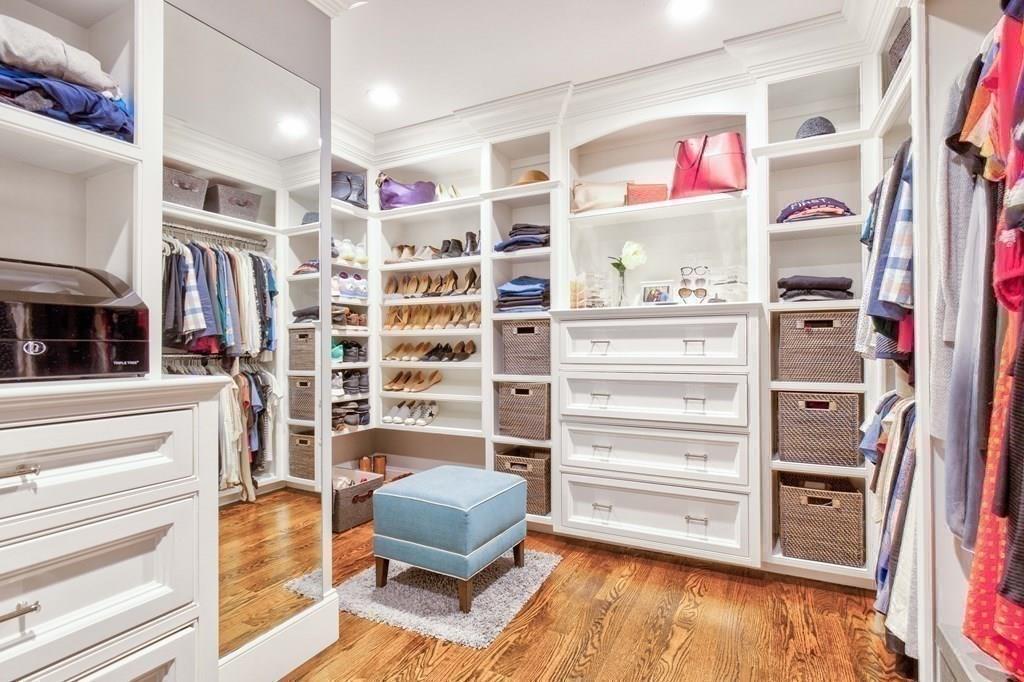 185 Cross Street Winchester, MA 01890 - Photo 15 of 41 a view of walk in closet with clothes and shoes