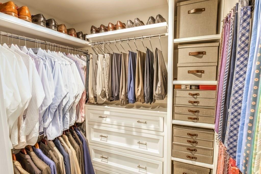 185 Cross Street Winchester, MA 01890 - Photo 16 of 41 a view of walk in closet with clothes and shoes