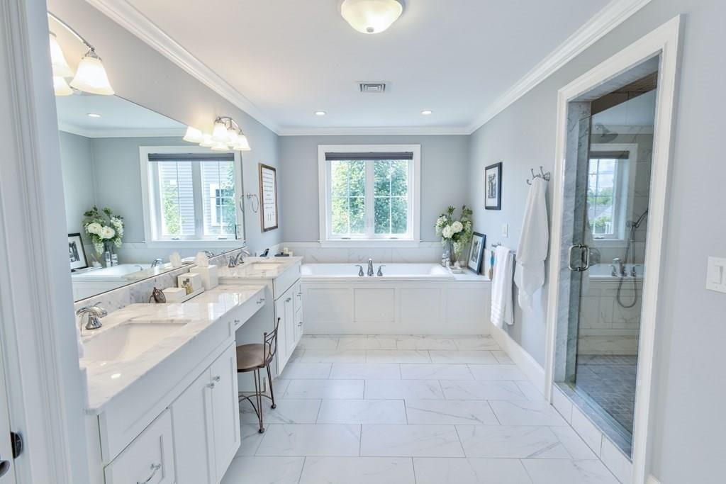 185 Cross Street Winchester, MA 01890 - Photo 17 of 41 a large white kitchen with a large window