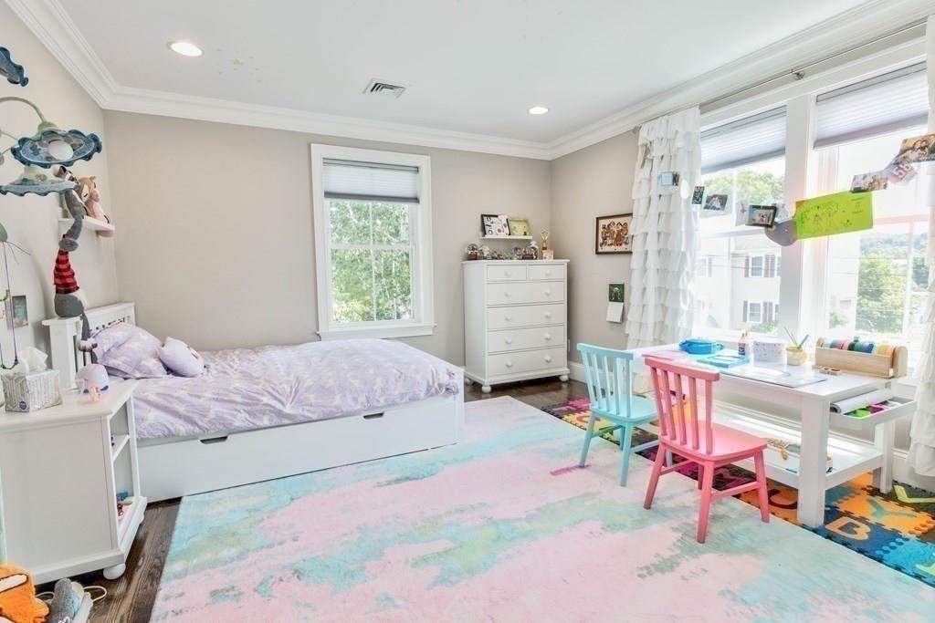 185 Cross Street Winchester, MA 01890 - Photo 20 of 41 a bedroom with a bed and a window