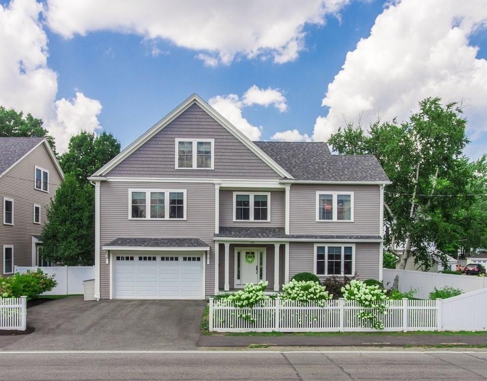 185 Cross Street Winchester, MA 01890 - Photo 2 of 41 a front view of a house with garden