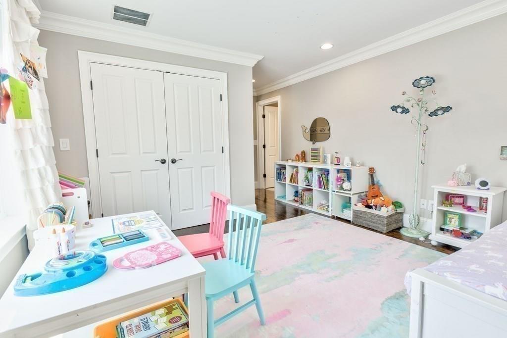 185 Cross Street Winchester, MA 01890 - Photo 21 of 41 a bedroom with bed and a table