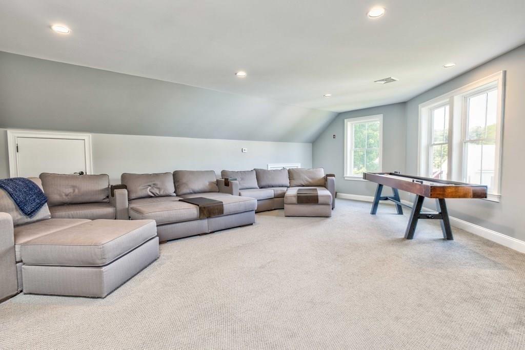 185 Cross Street Winchester, MA 01890 - Photo 25 of 41 a living room with furniture and a window