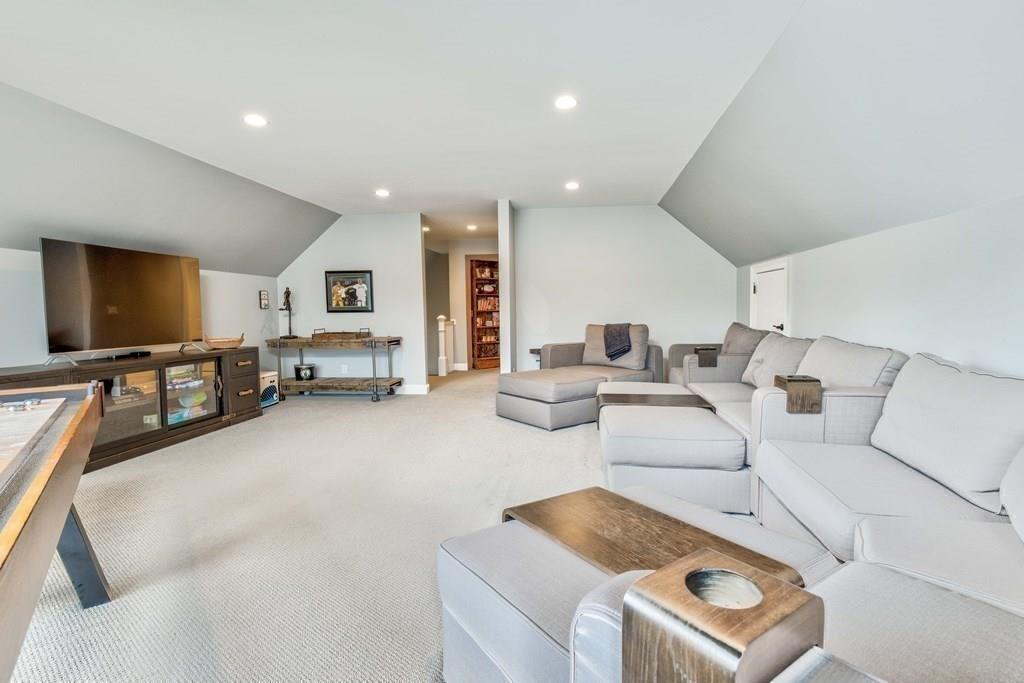185 Cross Street Winchester, MA 01890 - Photo 26 of 41 a living room with furniture and a flat screen tv