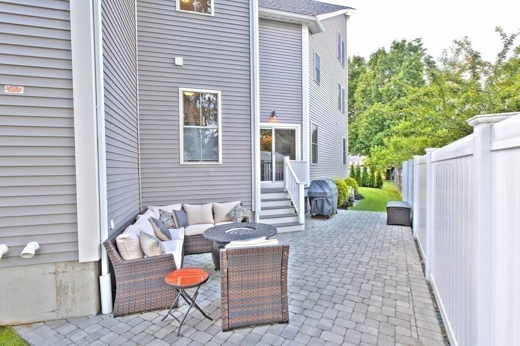 185 Cross Street Winchester, MA 01890 - Photo 39 of 41 a backyard of a house with seating space