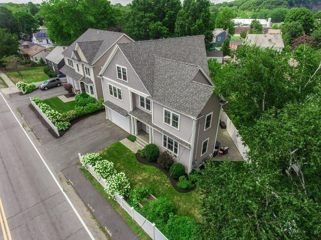 185 Cross Street Winchester, MA 01890 - Photo 41 of 41 an aerial view of multiple houses with a yard