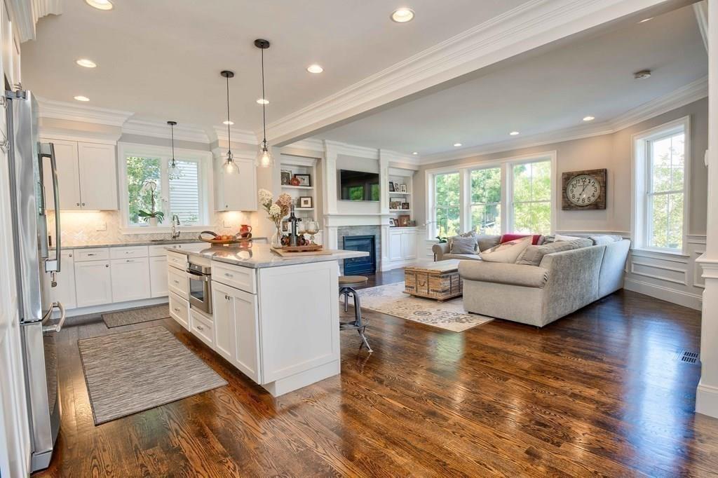 185 Cross Street Winchester, MA 01890 - Photo 7 of 41 a living room with fireplace furniture and a wooden floor