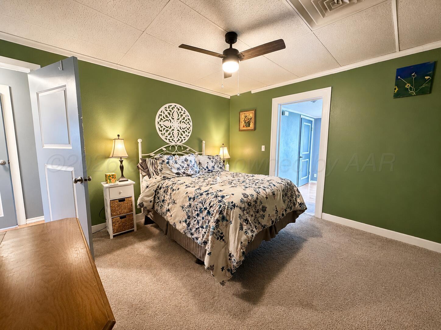 606 South Prospect Street Amarillo, TX 79106 - Photo 16 of 22 a bedroom with a bed and a table