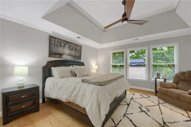a bathroom with a granite countertop double vanity sink mirror and shower